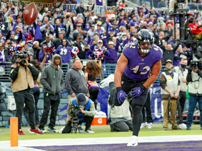 Pat Ricard spikes the ball in celebration of a touchdown in 2021